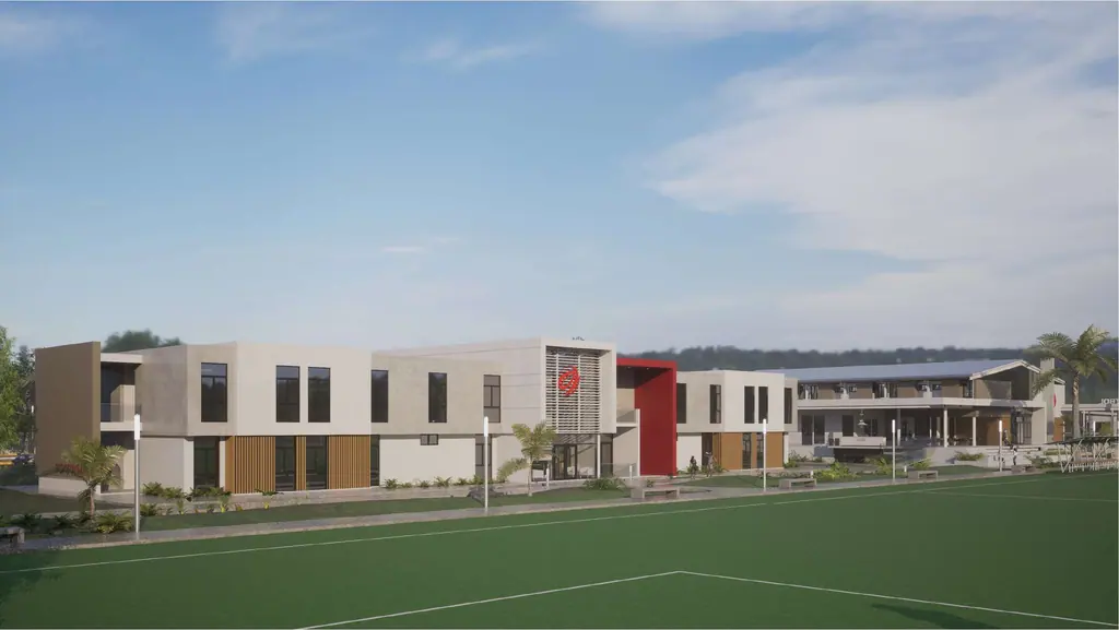 Render de la fachada del edificio residencial junto a un campo de fútbol